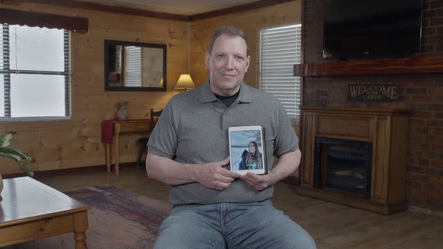 <p>courtesy netflix</p> Peter Betz holding a photo of his daughter Samantha.