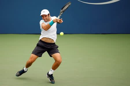 Sep 4, 2015; New York, NY, USA; Mikhail Kukushkin of Kazakhstan hits a forehand against Marin Cilic of Croatia (not pictured) on day five of the 2015 U.S. Open tennis tournament at USTA Billie Jean King National Tennis Center. Mandatory Credit: Geoff Burke-USA TODAY Sports