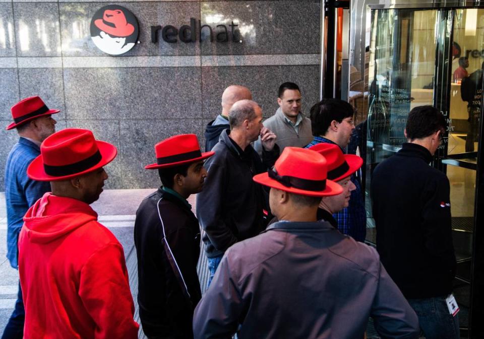 Red Hat employees walk back to their Raleigh headquarters after a meeting at the Duke Energy Center for the Performing Arts Monday, Oct. 29, 2018. IBM will acquire the Raleigh-based software maker in a $34 billion deal, the two companies announced Sunday.