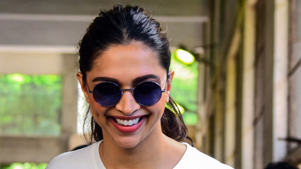 Bollywood actress Deepika Padukone shows her inked finger after casting her vote at a polling station during the state assembly election in Mumbai on October 21, 2019. - Sujit Jaiswal/AFP/Getty Images