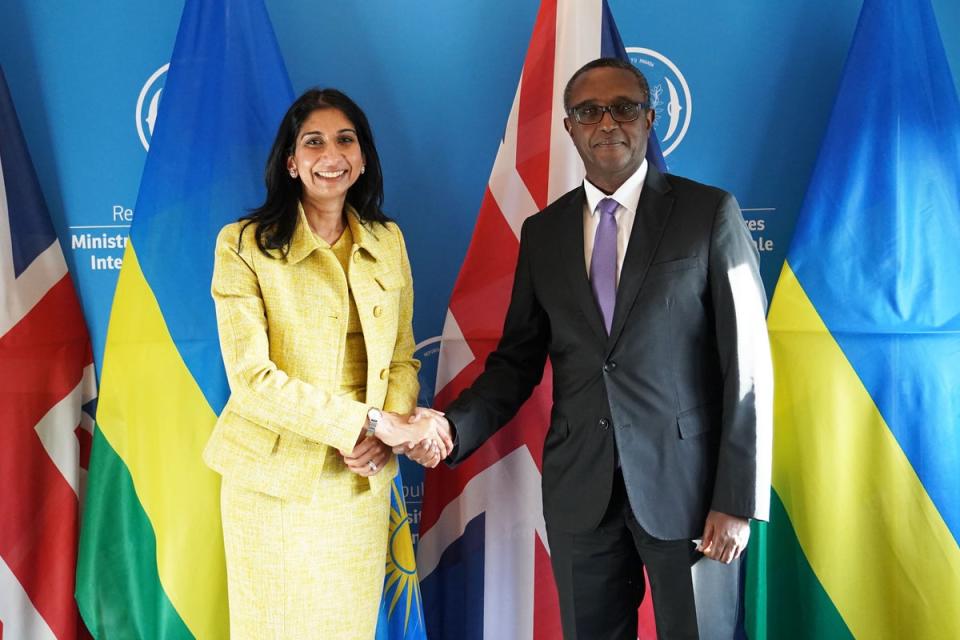 Braverman shakes hands with Rwandan foreign minister Vincent Biruta in Kigali (PA)