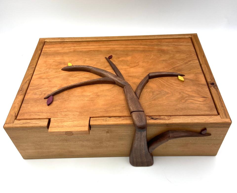 A cherry box with abstract walnut tree from Barry's Boxes in Providence.
