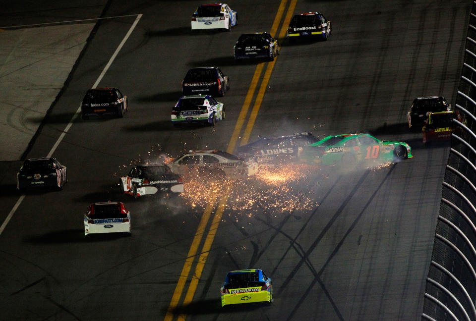 DAYTONA BEACH, FL - FEBRUARY 27: Danica Patrick, driver of the #10 GoDaddy.com Chevrolet, Jimmie Johnson, driver of the #48 Lowe's Chevrolet, David Ragan, driver of the #34 Front Row Motorsports Ford, and Kurt Busch, driver of the #51 Tag Heuer Avant-Garde Chevrolet Chevrolet, spin after an on track incident in the NASCAR Sprint Cup Series Daytona 500 at Daytona International Speedway on February 27, 2012 in Daytona Beach, Florida. (Photo by Tom Pennington/Getty Images for NASCAR)