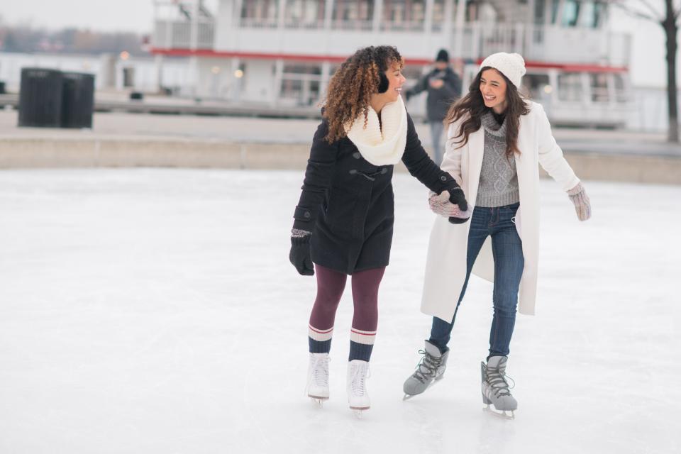 <h1 class="title">Adult Female Couple Ice Skating</h1><cite class="credit">FatCamera</cite>