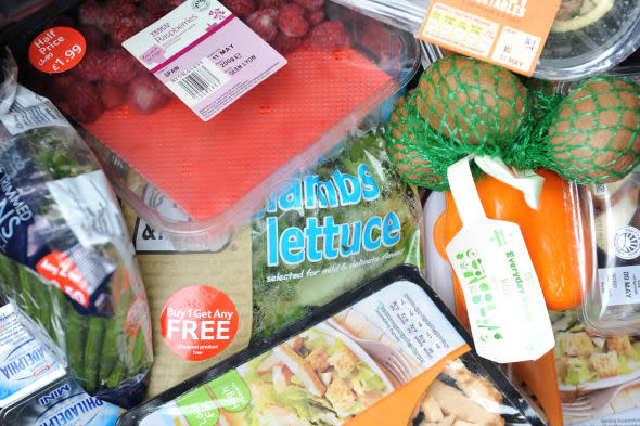 File photo dated 20/05/12 of out-of-date and unopened food from a domestic household thrown away in a dustbin as supermarkets should move away from offers such as 