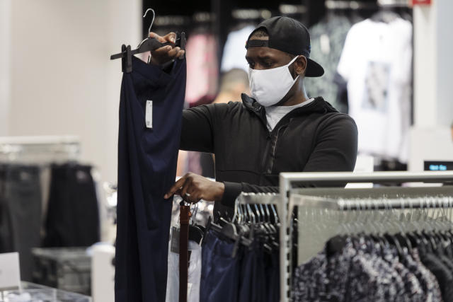 A customer wearing a protective mask shops at a Hennes &amp; Mauritz (H&amp;M) clothing store at Westfield San Francisco Centre in San Francisco, California, U.S., on Thursday, June 18, 2020. (Michael Short/Bloomberg via Getty Images)
