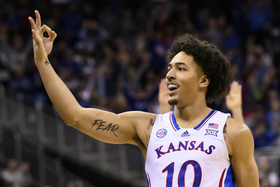 Kansas forward Jalen Wilson celebrates after hitting a three-point basket during the first half against Iowa State.