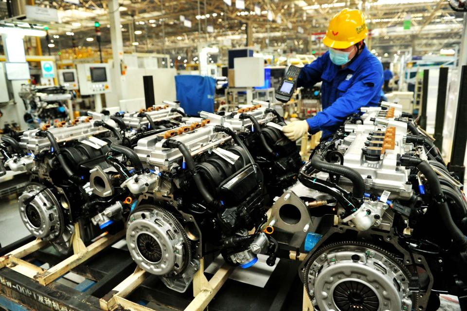 QINGDAO, CHINA - APRIL 30, 2020 - A worker of SAIC GM Wuling Automobile Co., Ltd. Qingdao branch is producing automobile engines on the production line. Qingdao, Shandong Province, China, April 30, 2020. China's Manufacturing Purchasing Managers Index (PMI) was 50.8% in April, according to the National Bureau of statistics.- PHOTOGRAPH BY Costfoto / Barcroft Studios / Future Publishing (Photo credit should read Costfoto/Barcroft Media via Getty Images)