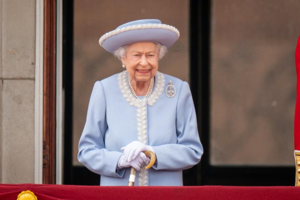 The Queen watching from the balcony at Buckingham Palace (Aaron Chown/PA) (PA Wire)