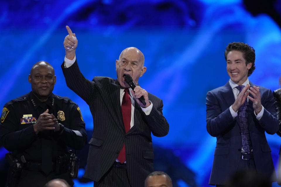 Houston Mayor John Whitmire speaks during a service at Lakewood Church Sunday, Feb. 18, 2024, in Houston. Pastor Joel Osteen, right, welcomed worshippers back to Lakewood Church for the first time since a woman with an AR-style opened fire in between services at his Texas megachurch last Sunday. (AP Photo/David J. Phillip)