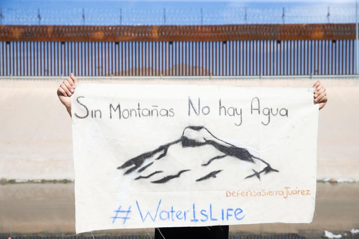 Mexican environmentalists hold a "prayer and healing" ceremony at the Rio Bravo, known as the Rio Grande in the United States, to bring attention to the ecological damage the river sustains from both sides of the border, according to the environmentalists. In this photo, a group prays and asks for forgiveness from the river March 27.