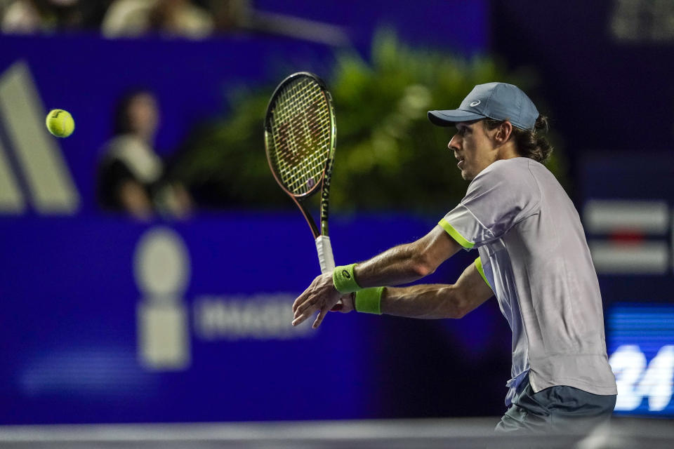 Alex de Minaur of Australia plays a forehand return to Tommy Paul of the United States in the final match at the Mexican Open tennis tournament in Acapulco, Mexico, Saturday, March 4, 2023. (AP Photo/Eduardo Verdugo)