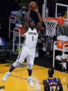 New Orleans Pelicans forward Zion Williamson (1) dunks during the first quarter of the team's NBA basketball game against the Los Angeles Lakers Friday, Jan. 15, 2021, in Los Angeles. (AP Photo/Ashley Landis)