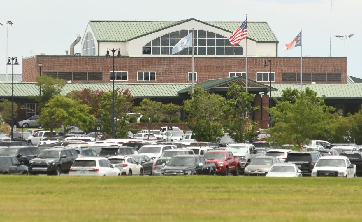 Wilmington International Airport is seeing a record number of travelers and needs more parking. The airport has submitted plans to add hundreds of parking spaces and eventually a parking structure.  KEN BLEVINS/STARNEWS