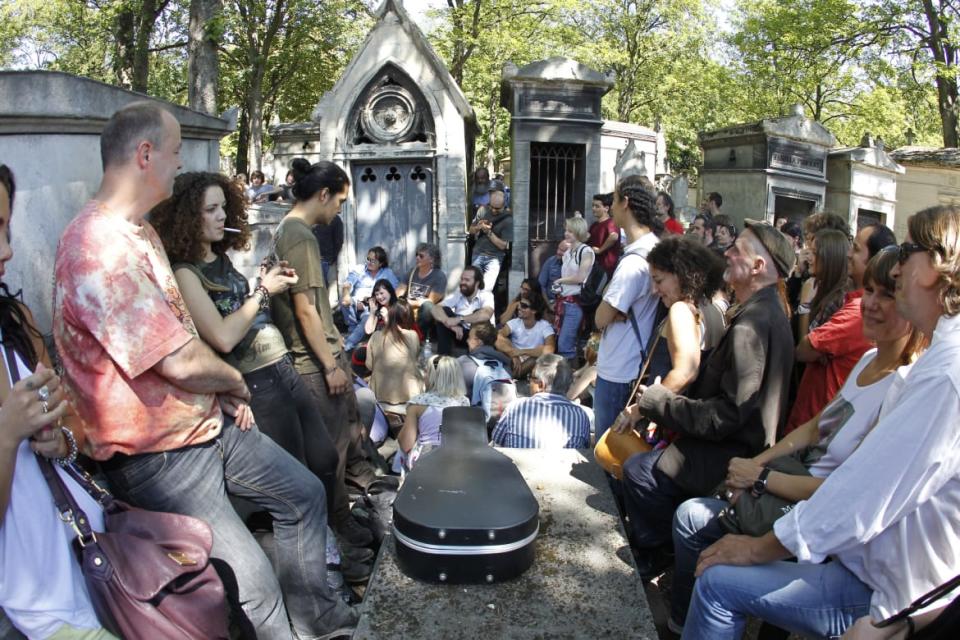 <div class="inline-image__caption"><p>A group of people gather to pay homage, on July 3, 2011, in front of singer Jim Morrison's tomb at the Pere Lachaise cemetery in Paris, 40 years after Morrison was found dead in a bathtub in his Paris apartment.</p></div> <div class="inline-image__credit">Francois Guillot/AFP/Getty</div>