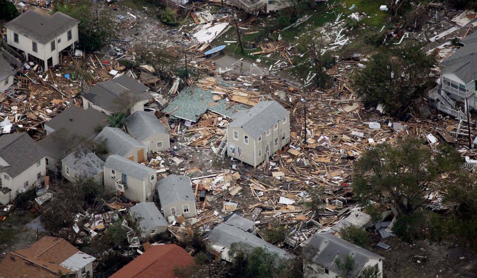 debris surrounds some homes still standing from hurricane ike damage in texas