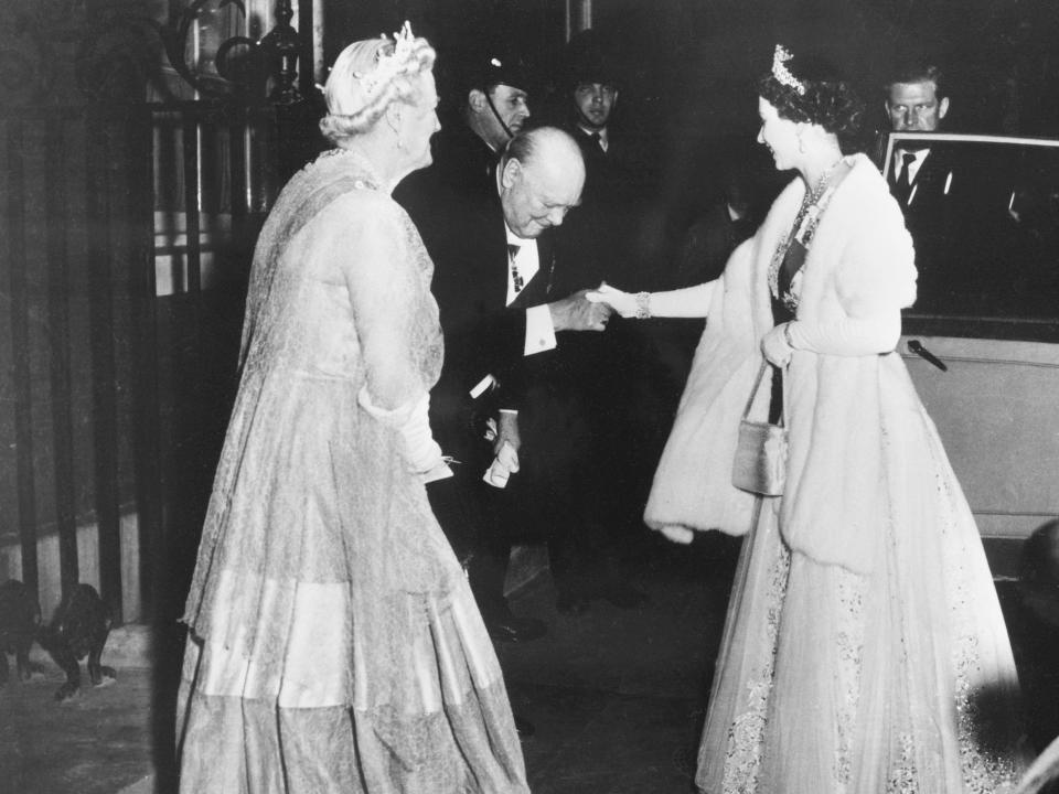 Winston Churchill bowing to Queen Elizabeth outside of 10 Downing Street in 1955