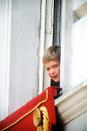 <p>Prince William stretches his head out the window for a peek at the parade.</p>