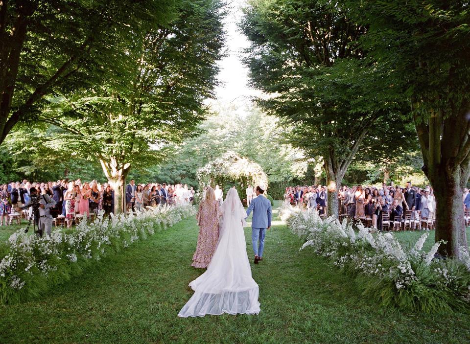 As I walked down the aisle to meet my parents, I was overwhelmed with emotion. The love was truly palpable. Lee stood at the end of the chuppah waiting to meet me as the sun glistened over him, creating a natural spotlight.