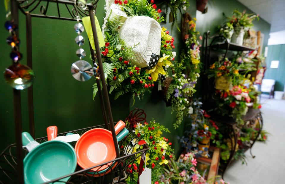 Floral arrangements for sale at Fina's Market, a 6,300-square-foot vendor market specializing in local, handcrafted goods at 1635 W. Walnut St. on Friday, April 21, 2023.