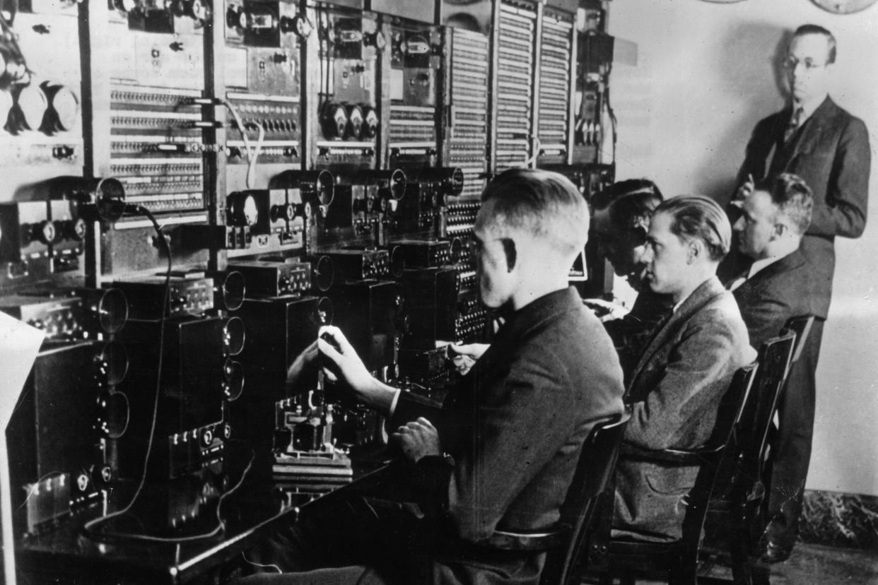 15th november 1926: chief engineer o.b. hanson (standing right) gives the signal to put the first nbc show on the air inside the main control room at the american telephone and telegraph company building, new york city