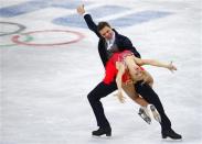 Russia's Ekaterina Bobrova (front) and Dmitri Soloviev compete during the figure skating ice dance short dance program at the Sochi 2014 Winter Olympics February 16, 2014. REUTERS/David Gray