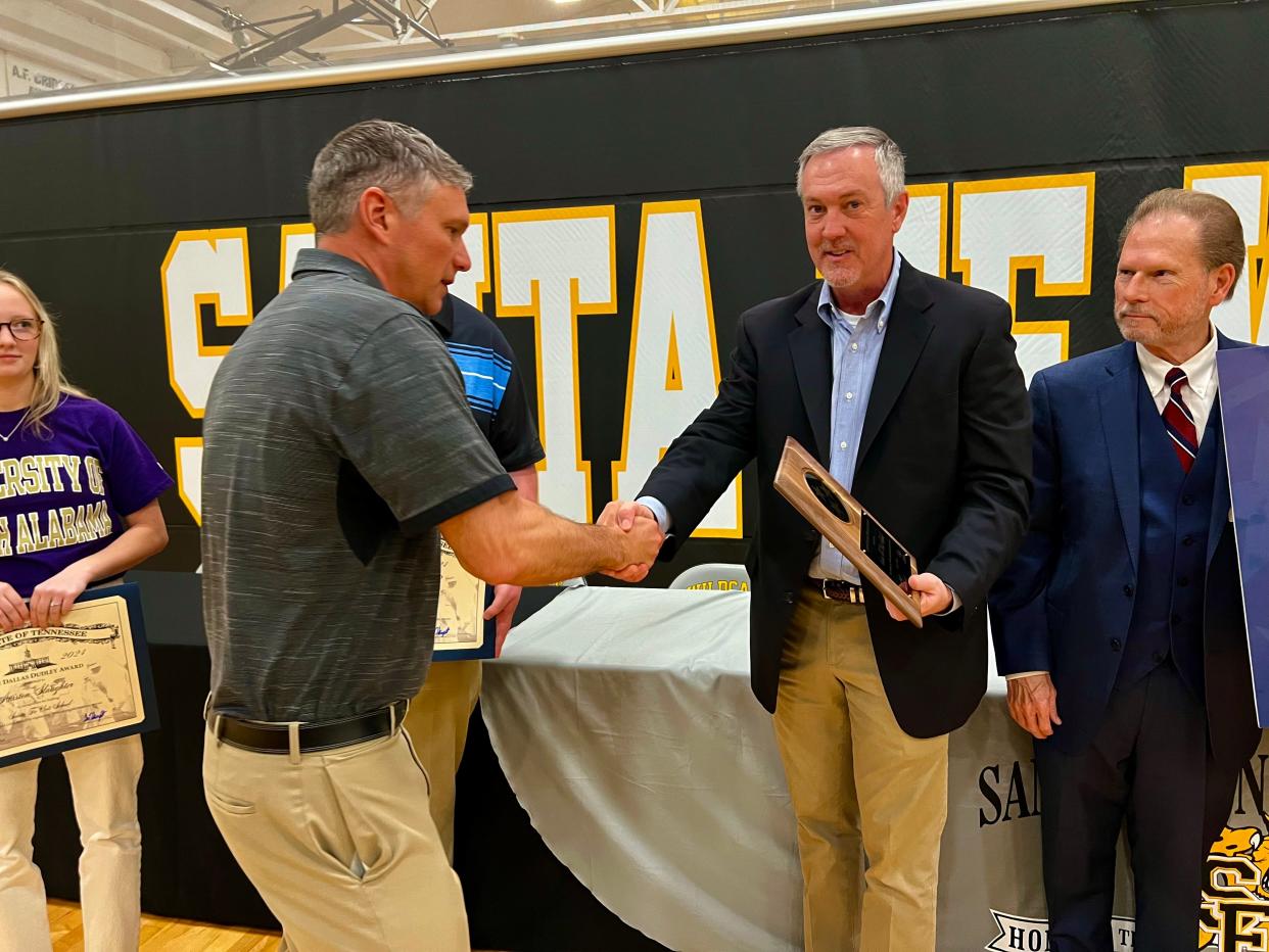 Secretary of State Tre Hargett, right, presents a commemorative plaque to Jonathon Slaughter, Santa Fe Unit School's professor of government, history and economics in honor of the school's Gold Level Anne Dallas Dudley Award for 100% eligible student voter registration.