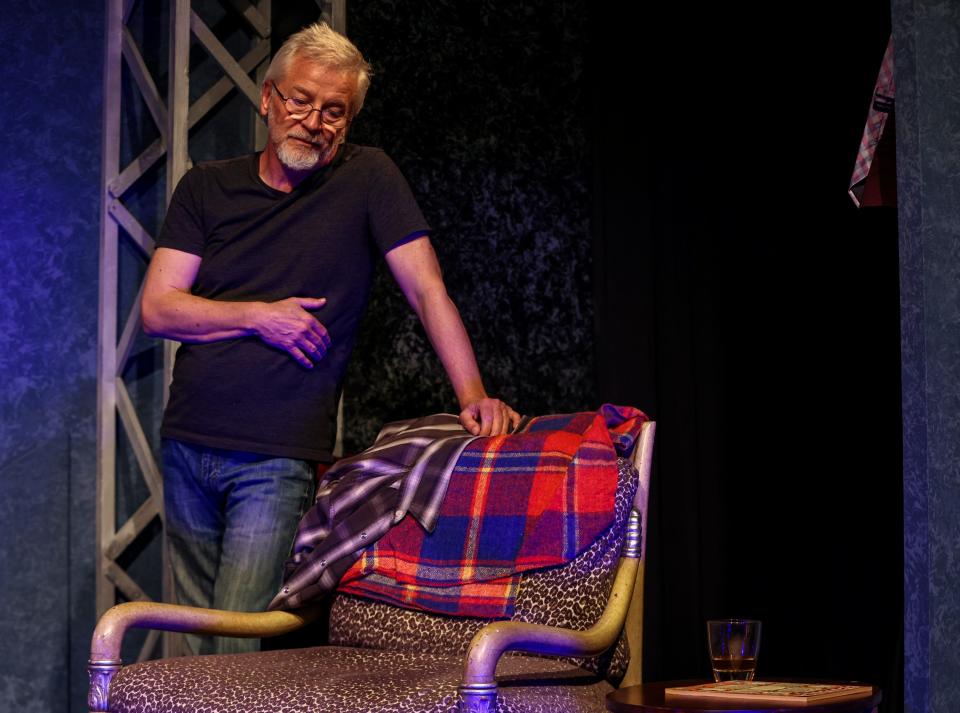 Essayist John D’Agata, played by Chuck Yates, makes an example of a chair in his living room that holds a special significance to him during his argument with his fact checker during a dress rehearsal for Desert Ensemble Theatre's "The Lifespan of a Fact" at the Palm Springs Cultural Center in Palm Springs, Calif., Wednesday, Jan. 24, 2024.