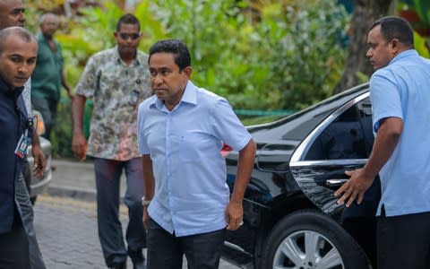 Maldives President Abdulla Yameen arrives at a polling station in the capital Male on September 23 - Credit:  AHMED SHURAU/ AFP