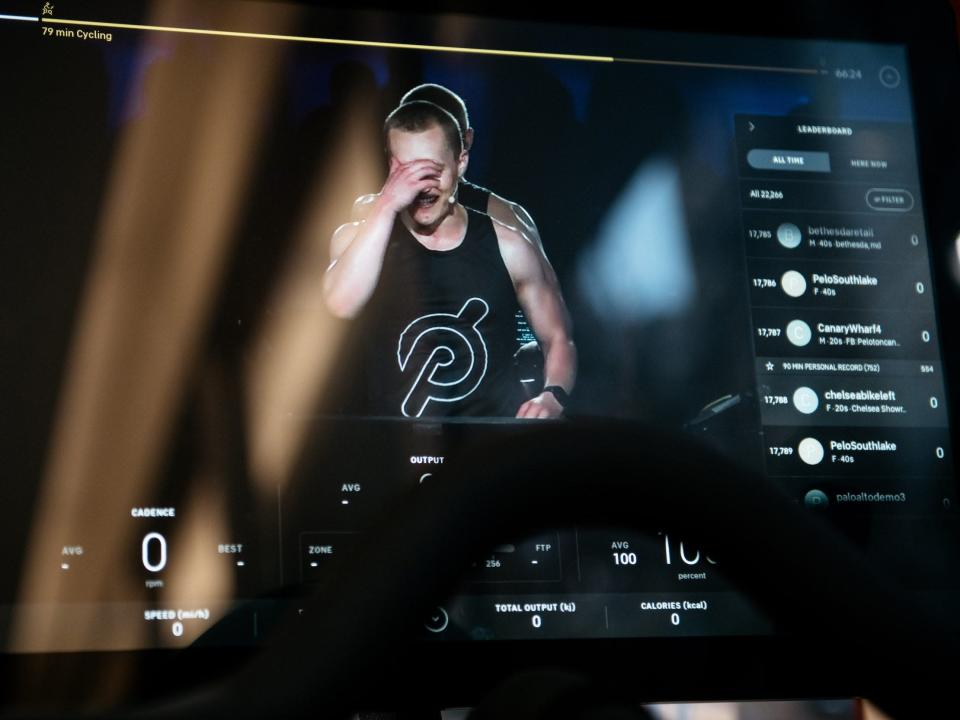 A Peloton instructor seen on the video display of a Peloton stationary bike