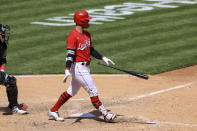 Cincinnati Reds' Jesse Winker throws his bat after hitting an RBI walk-off single during the tenth inning of a baseball game against the Chicago White Sox in Cincinnati, Wednesday, May 5, 2021. The Reds won 1-0. (AP Photo/Aaron Doster)