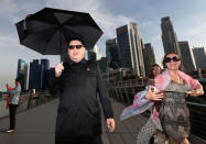 Howard, an Australian-Chinese impersonating North Korean leader Kim Jong Un, strolls down Jubilee Bridge in Singapore May 27, 2018. REUTERS/Edgar Su