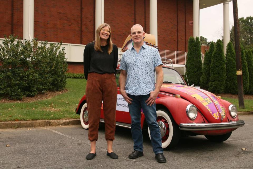 Rebecca Lipps and Mark Doepker with a 1969 Volkswagen Beetle — the platform for the Eyelumination Project.