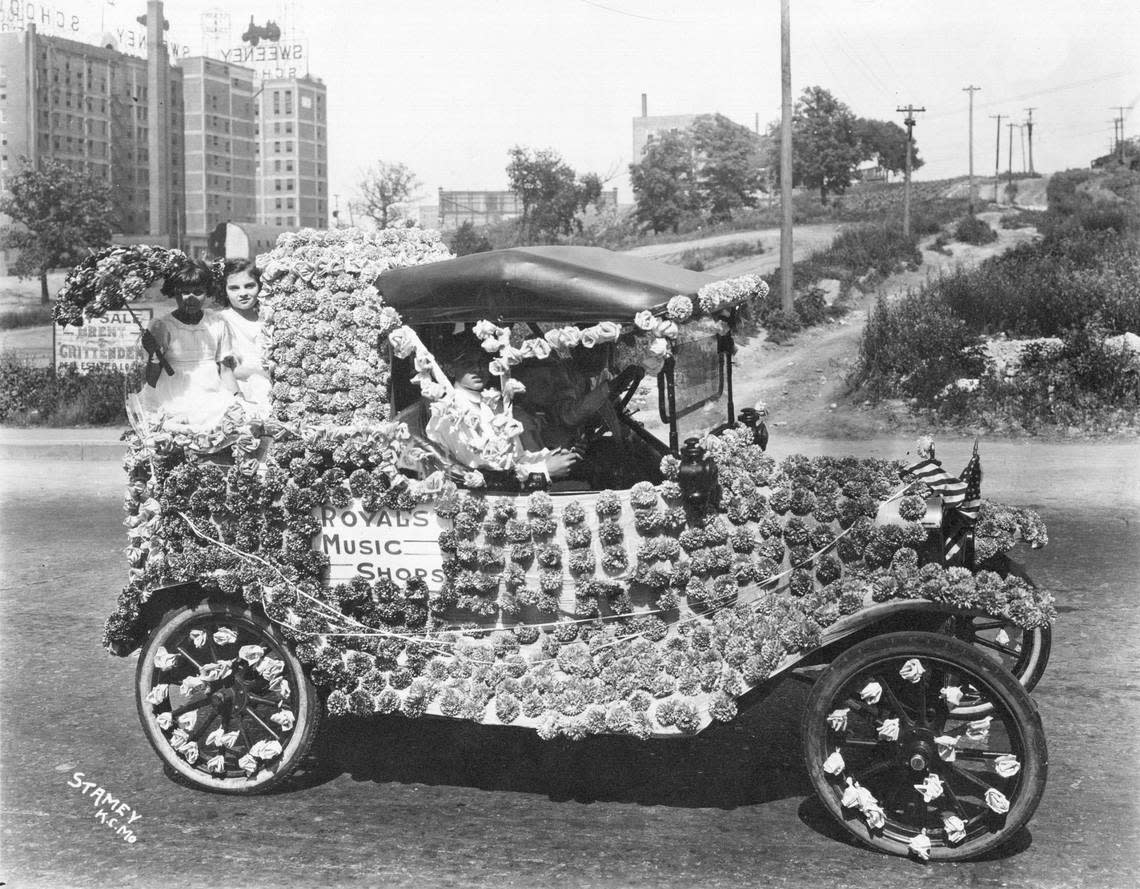 A Model T Ford decorated for one of the 1920s parades.