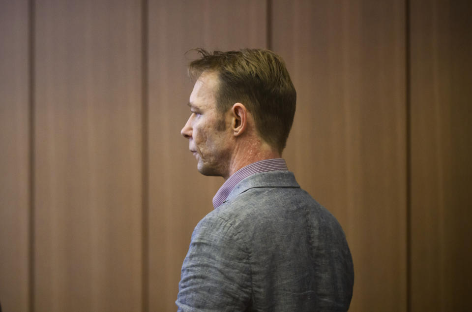 Christian B. arrives at the start of his trial, at Braunschweig district court, in Brunswick, Germany, Friday, Feb. 16, 2024. A man who is also a suspect in the disappearance of British toddler Madeleine McCann goes on trial Friday over several sexual offenses he is alleged to have committed in Portugal between 2000 and 2017. (Julian Stratenschulte/dpa via AP)