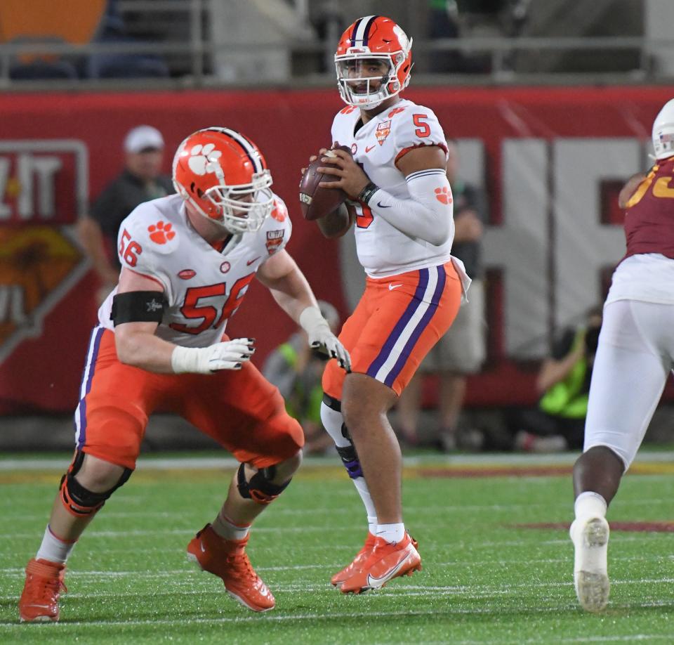 Clemson offensive lineman Will Putnam (56) blocks near quarterback D.J. Uiagalelei (5) during the second quarter of the 2021 Cheez-It Bowl at Camping World Stadium in Orlando, Florida Wednesday, December 29, 2021.