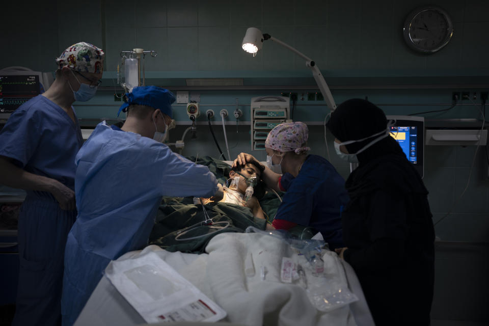 Abdulrahman, 2, receives medical attention by members of the Novick Cardiac Alliance medical team in the intensive care unit of the Tajoura National Heart Center in Tripoli, Libya, on Feb. 26, 2020. (AP Photo/Felipe Dana)