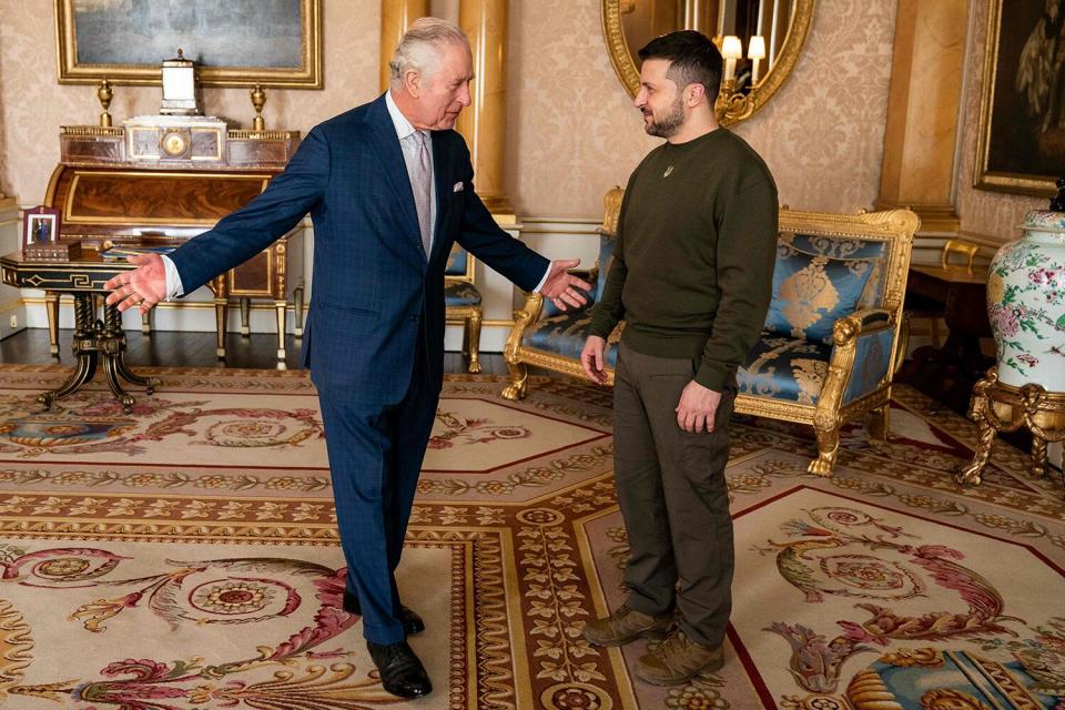 King Charles III (L) welcomes Ukraine's President Volodymyr Zelensky (R) at Buckingham Palace, in London, ahead of an audience during his first visit to the UK since the Russian invasion of Ukraine