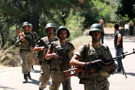 Turkish soldiers search for missing military personnel suspected of being involved in the coup attempt in Marmaris, Turkey, July 18, 2016. REUTERS/Kenan Gurbuz