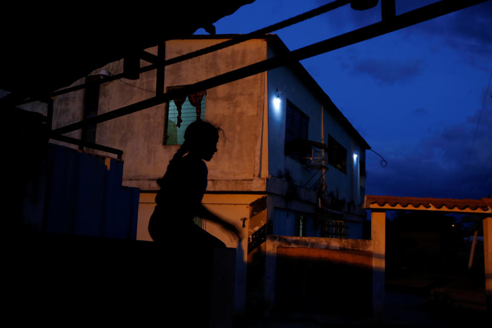 Aranza, sister of Maroly Bastardo, plays outside the family house in El Tigre, Venezuela, on June 3. (Photo: Ivan Alvarado/Reuters)