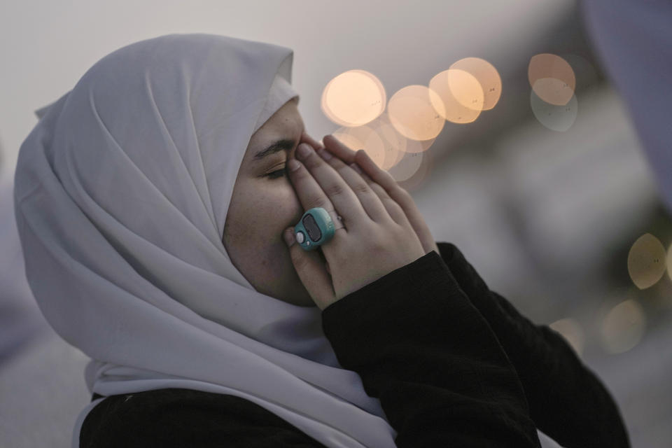 An Egyptian pilgrim prays on the rocky hill known as the Mountain of Mercy, on the Plain of Arafat, during the annual Hajj pilgrimage, near the holy city of Mecca, Saudi Arabia, Tuesday, June 27, 2023. Around two million pilgrims are converging on Saudi Arabia's holy city of Mecca for the largest Hajj since the coronavirus pandemic severely curtailed access to one of Islam's five pillars. (AP Photo/Amr Nabil)