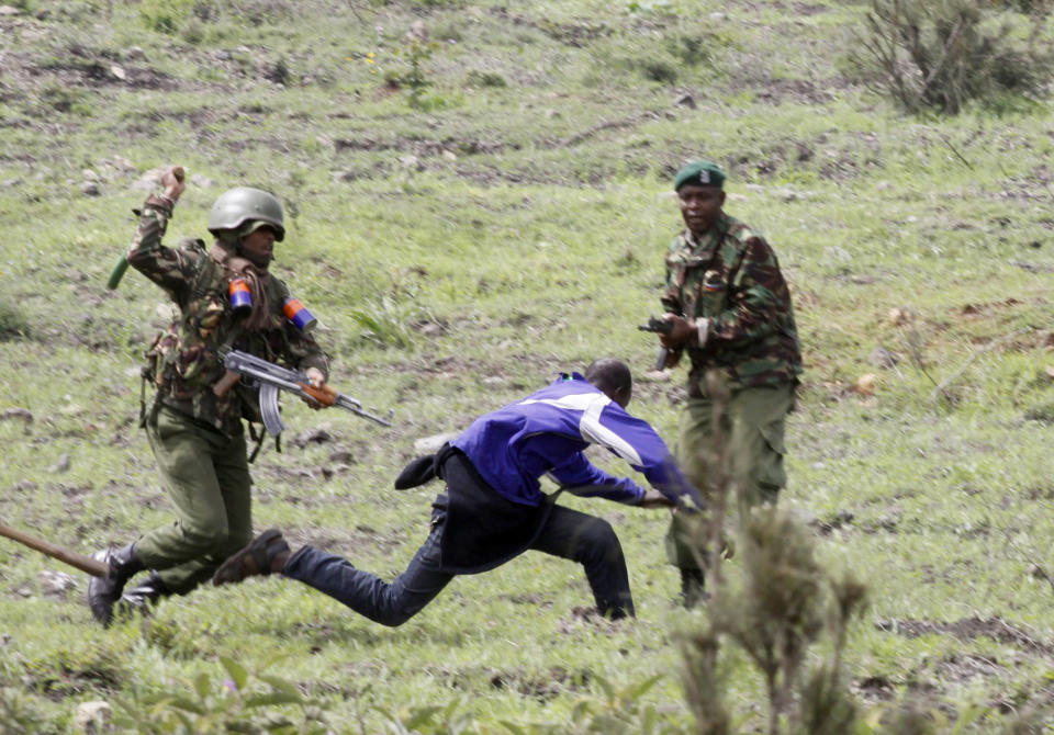 <p>Kenya riot police chase and prepare to strike a supporter of Kenyan opposition National Super Alliance (NASA) coalition in Nairobi, Kenya, Friday, Nov. 17, 2017. (Photo: Khalil Senosi/AP) </p>