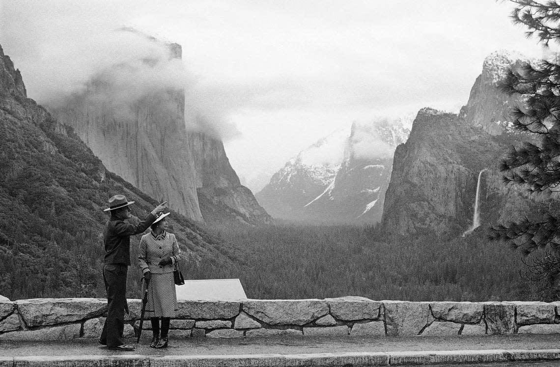 Park superintendent Bob Binnewies points out highlights from Inspiration Point to Queen Elizabeth II during her visit to Yosemite National Park on March 5, 1983. Walt Zeboski/Associated Press
