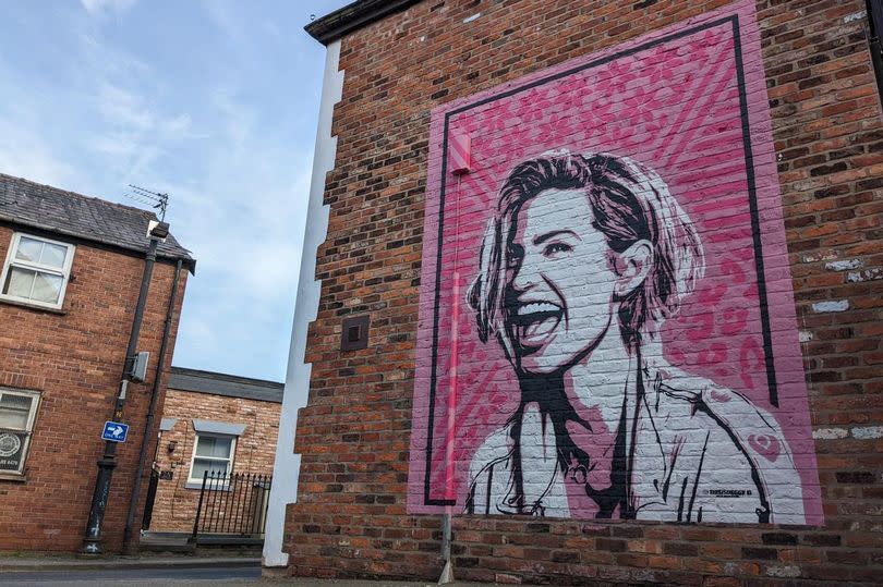A mural of Sarah Harding has appeared in Stockport