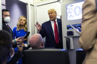 President Donald Trump talks with reporters on Air Force One after participating in the final presidential debate, Thursday, Oct. 22, 2020, in Nashville, Tenn. (AP Photo/Evan Vucci)