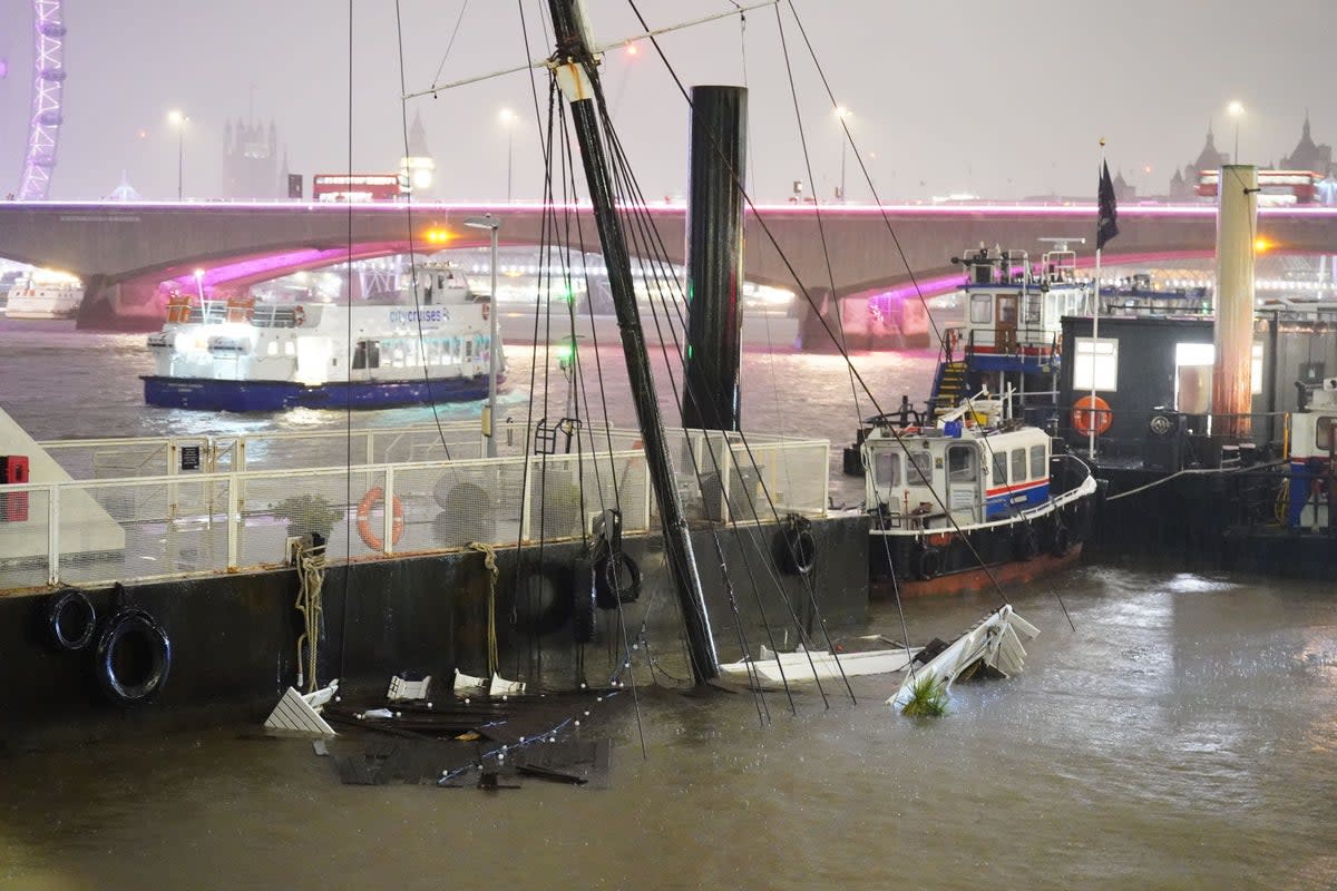 The mast of the sunken Bar & Co boat, which was moored at Temple Pier  (PA )