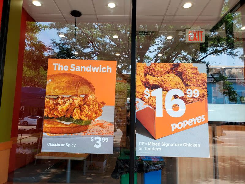 FILE PHOTO - Signs advertising menu items are seen at fast food restaurants in New York City