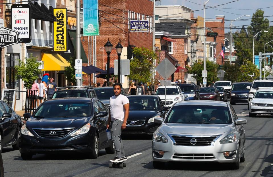 Newark's Main Street is bustling as traffic and business pick up with the return of students to campus at the University of Delaware, Saturday, August 27, 2022.