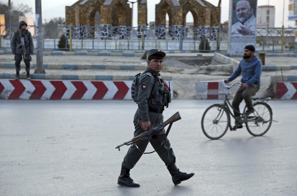 Afghan security forces arrive at the site of an explosion and attack by gunmen, in Kabul, Afghanistan, Monday, Dec. 24, 2018. (AP Photo/Rahmat Gul)