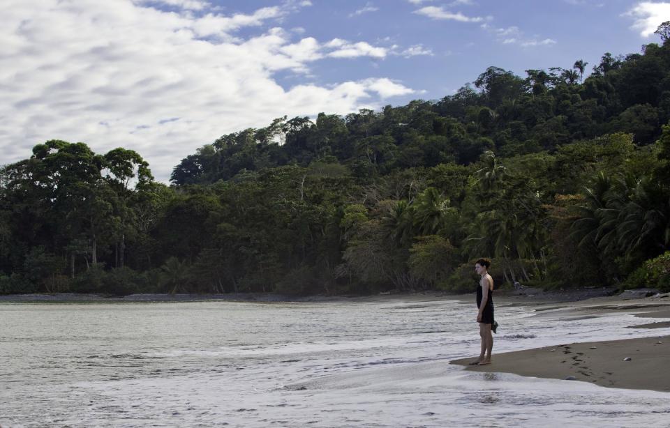 This undated photo shows a woman on the beach at the Lapa Rios Lodge in Costa Rica. Owner Hans Pfister says business at the lodge was hurt last year by concerns over the Zika virus, which is spread by mosquitoes, but this year Zika has faded from the headlines and Pfister says his guests are back. (Lapa Rios Lodge via AP)